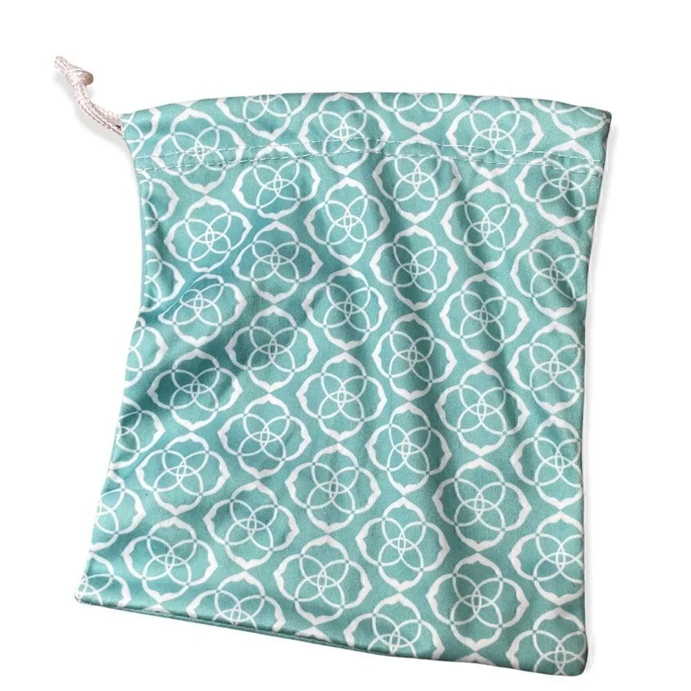 Kendra Scott jewelry bag in turquoise with white signature pattern drawstring